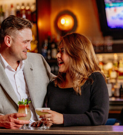 Couple enjoying drinks in the lounge